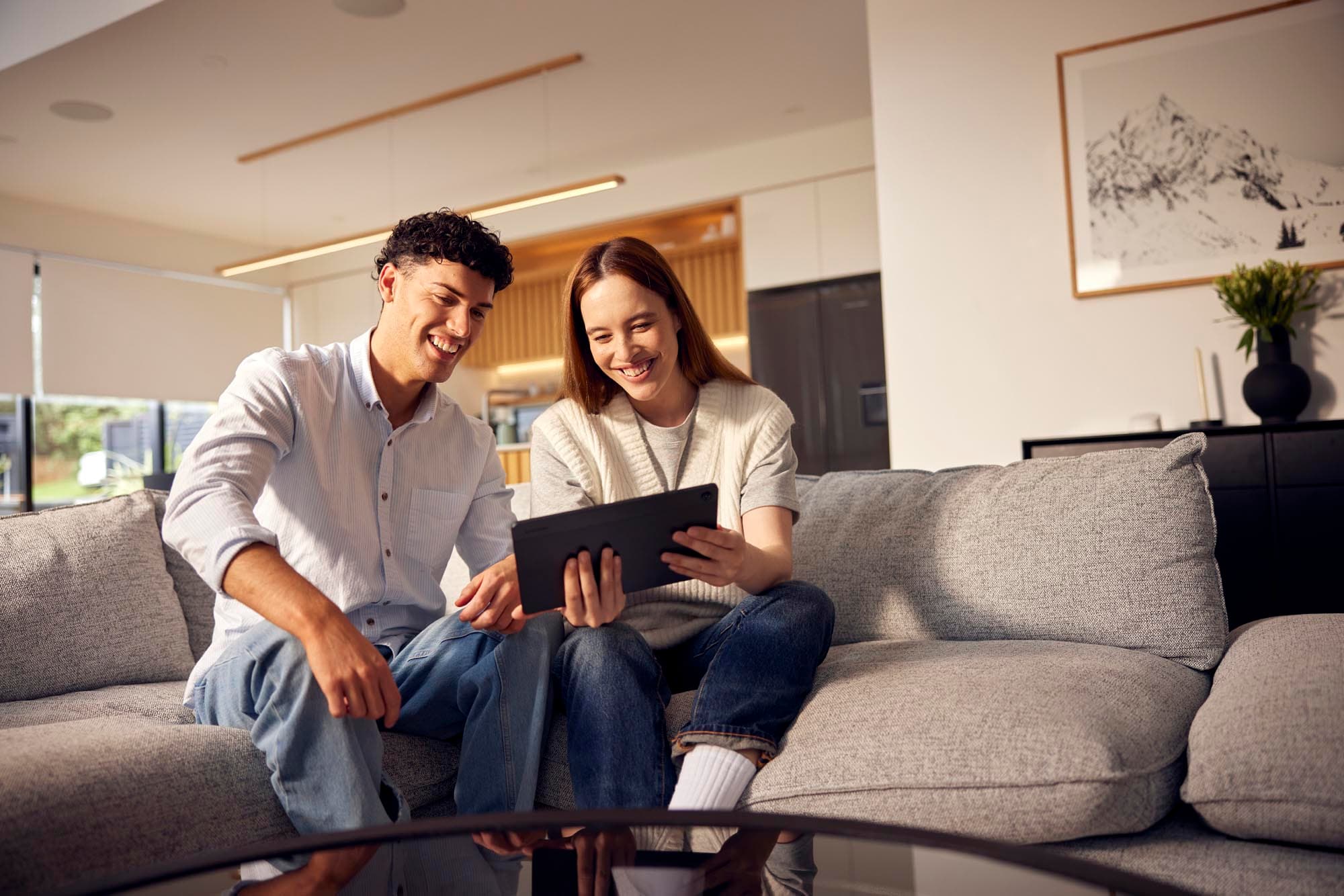 Couple Using Tablet on Couch 2570