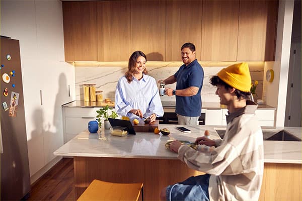 Family cooking and chatting together.