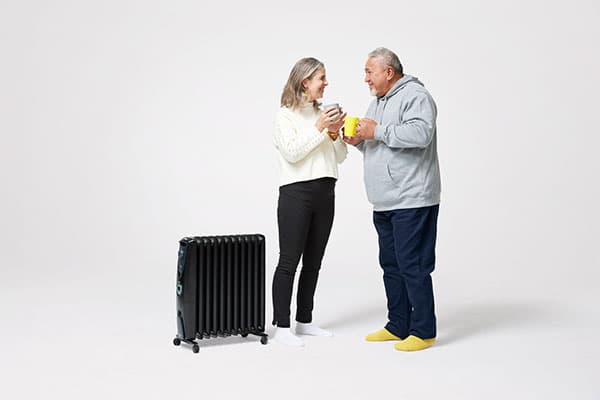Man and woman next to heater content tile
