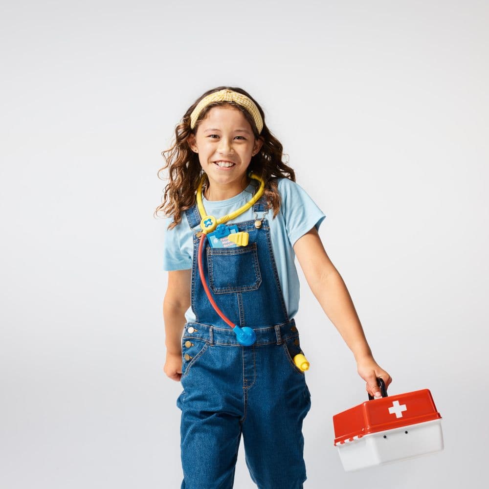 Little girl holding a first aid kit