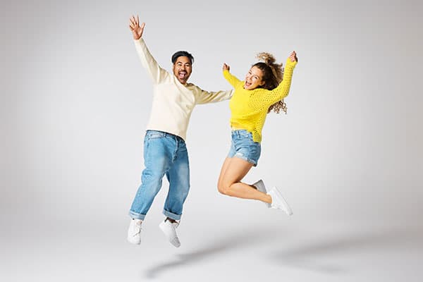 Studiolifemanandwomanhappyjumpcontenttile