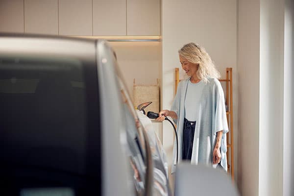 Woman Charging EV content tile