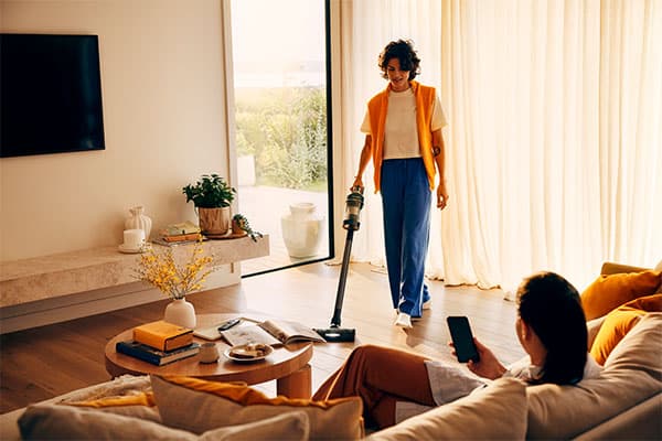 Women cleaning lounge.