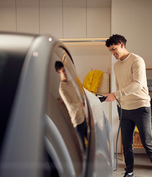 Man Charging EV in Garage hero mobile