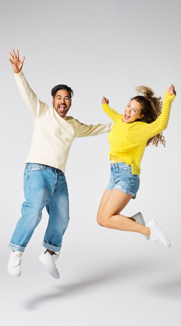 Studio life man and woman happy jump lo res 600x1080