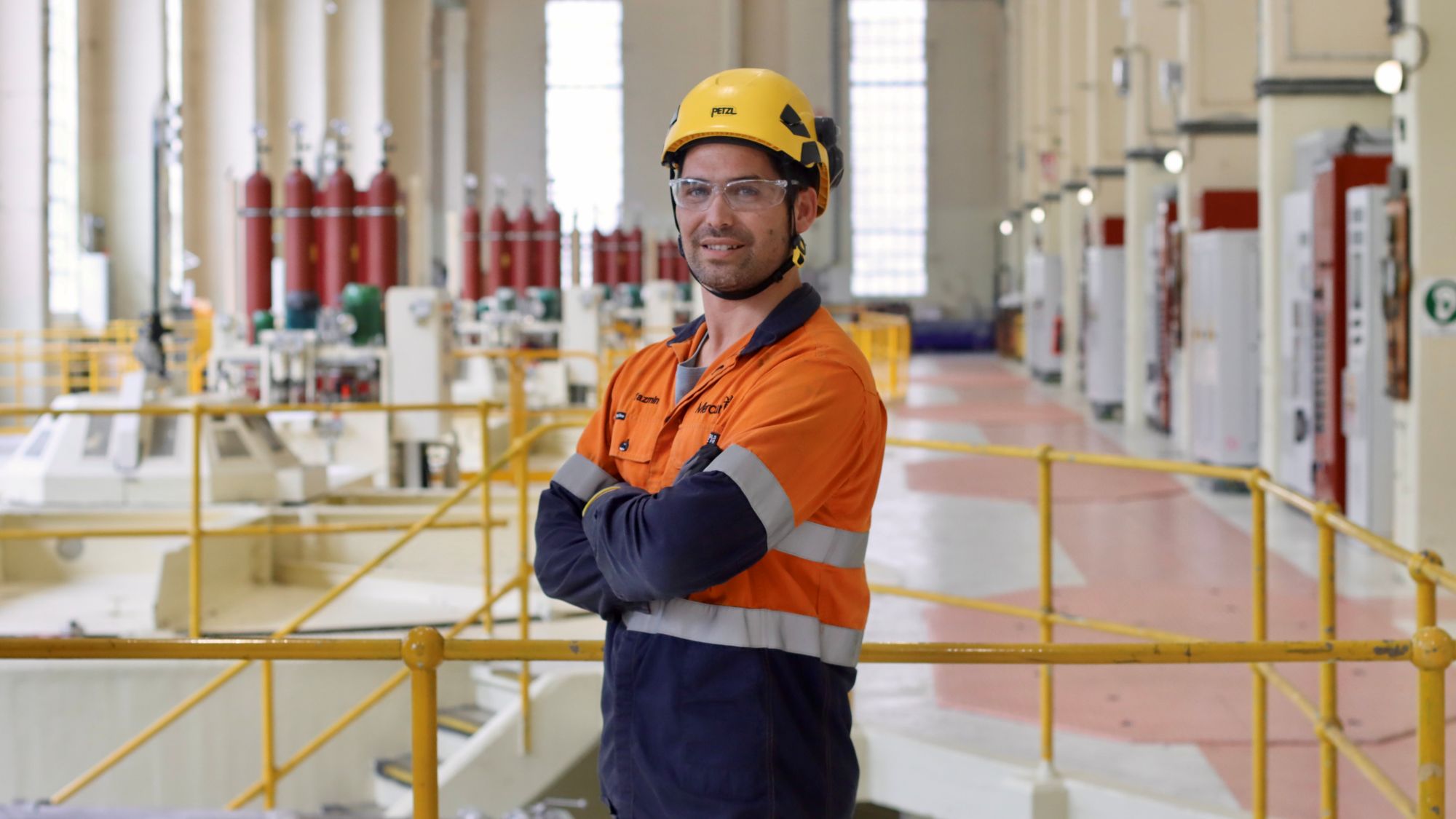 Taz Lowen in PPE stood inside turbine hall at Arapuni Hydro Station
